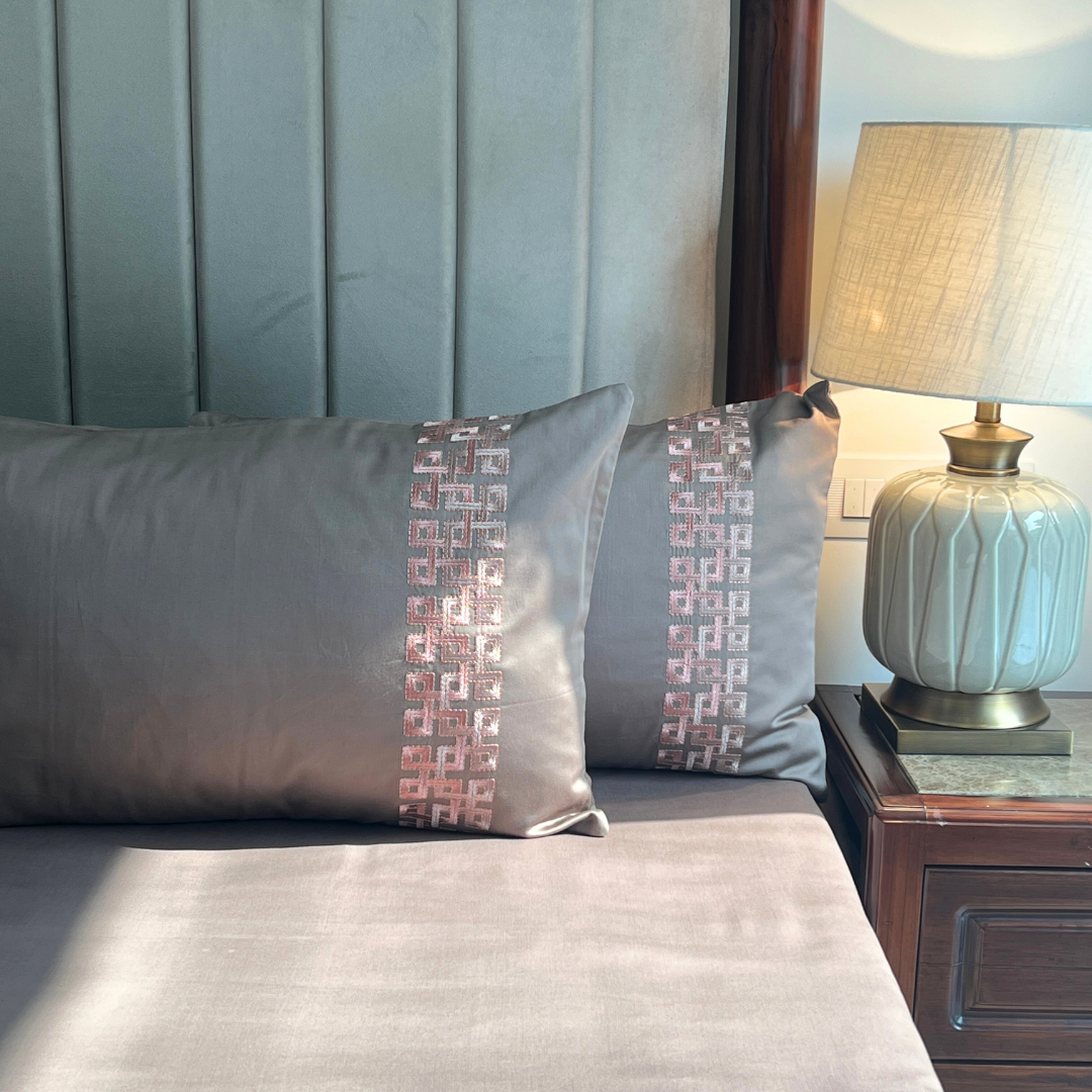 Close-up of Evara taupe embroidered pillow cover