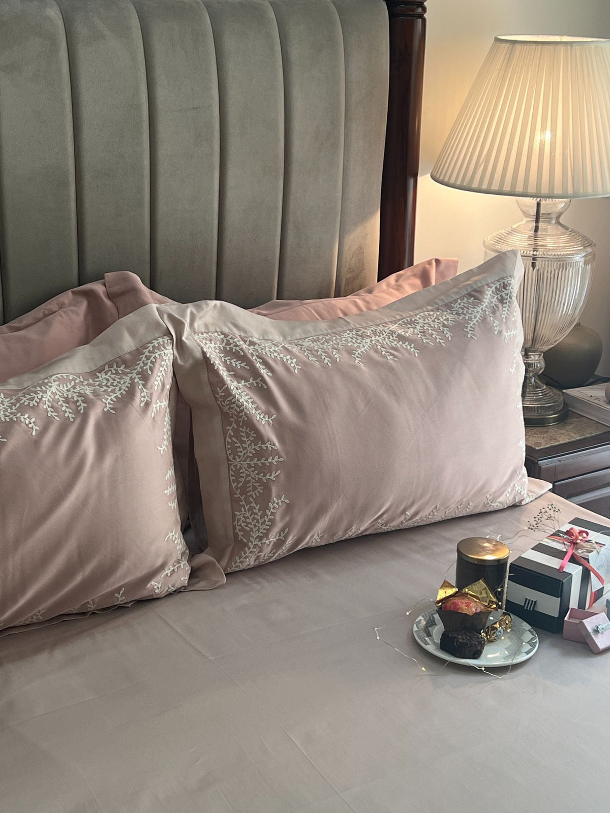 Close-up of rose buff embroidered pillow cover