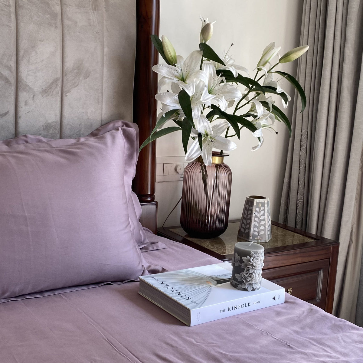 Old rose pillow covers arranged on bed