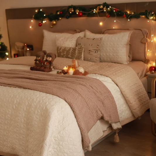 Beige cotton reversible bedspread with geometric pattern.