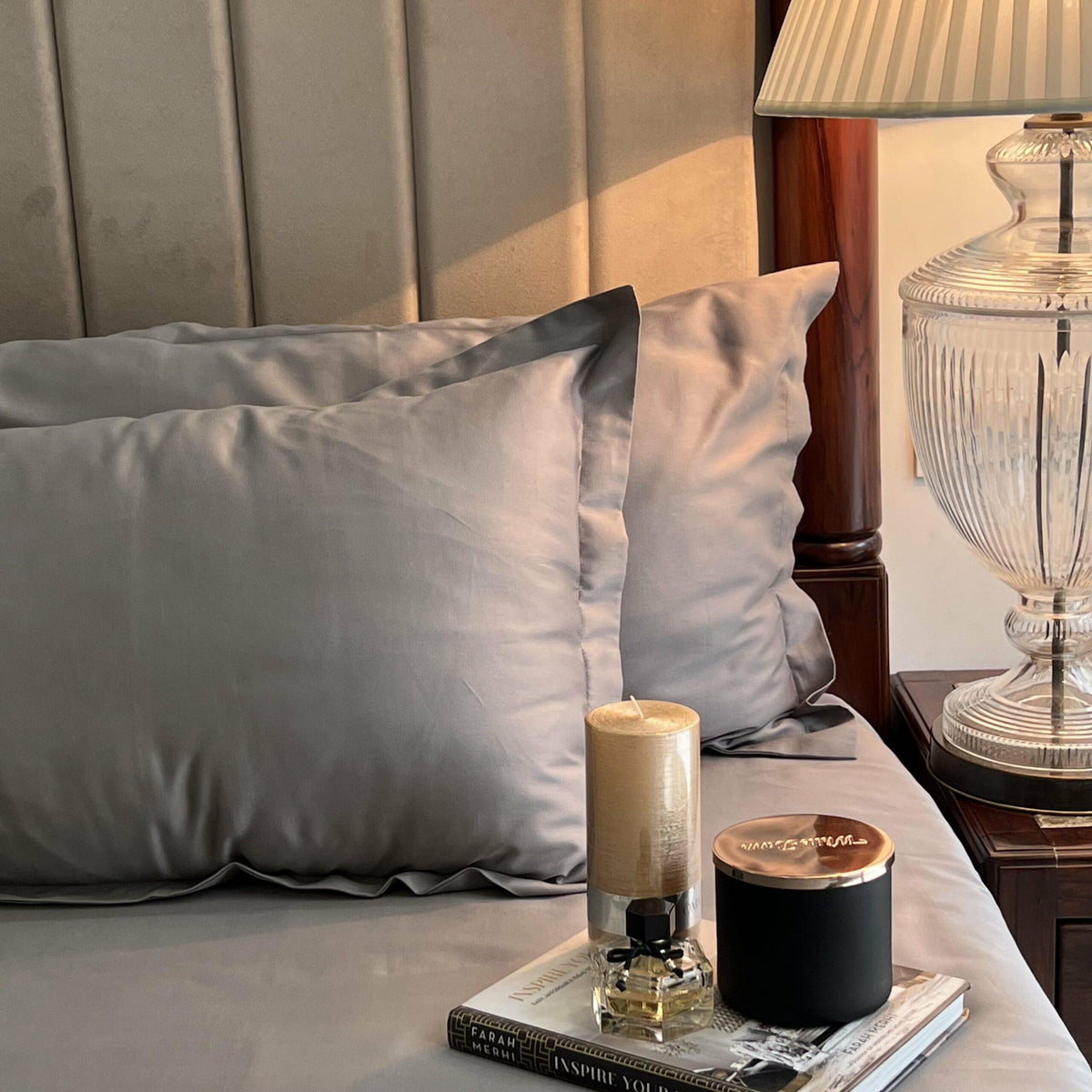 Close-up of the slate grey cotton satin pillow covers