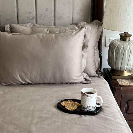Mocha brown bedsheet styled on a bed