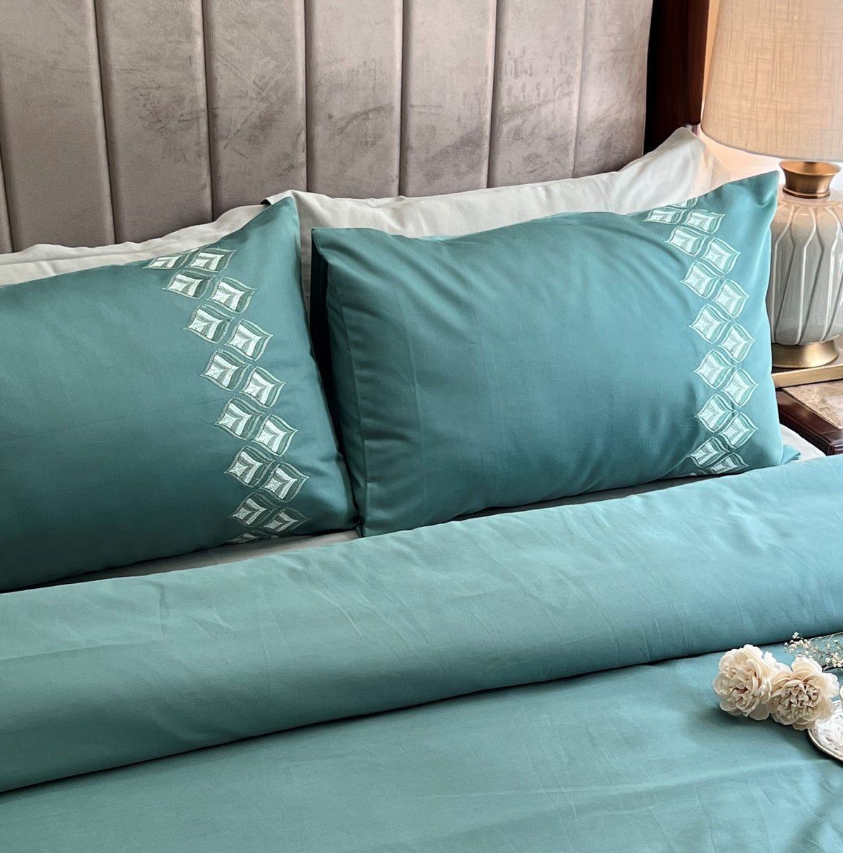 Leaflet turquoise Syona bedsheet set styled on bed