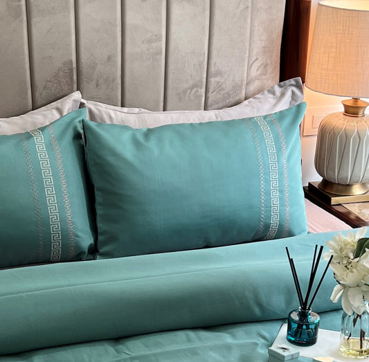Turquoise Lucas Syona bedsheet set styled on bed