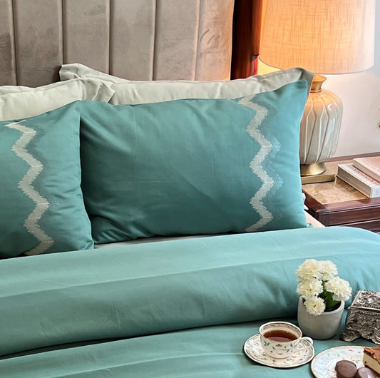Turquoise Syona bedsheet set styled on bed
