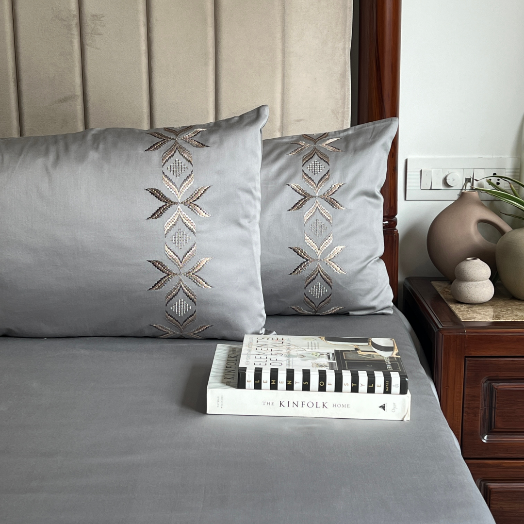 Close-up of Nadine slate embroidered pillow cover