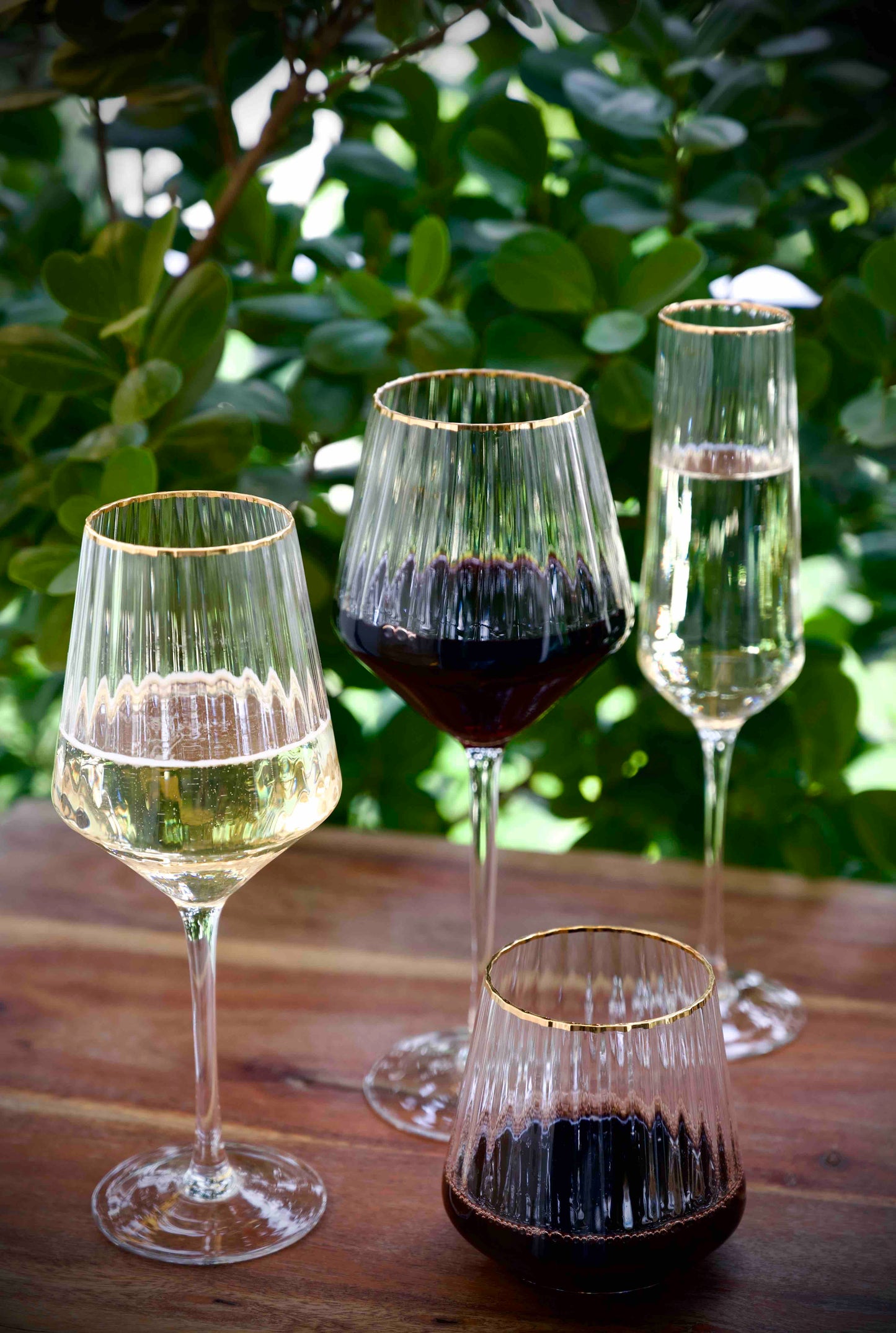 Elegant ribbed wine glasses with gold rim details, set of six.