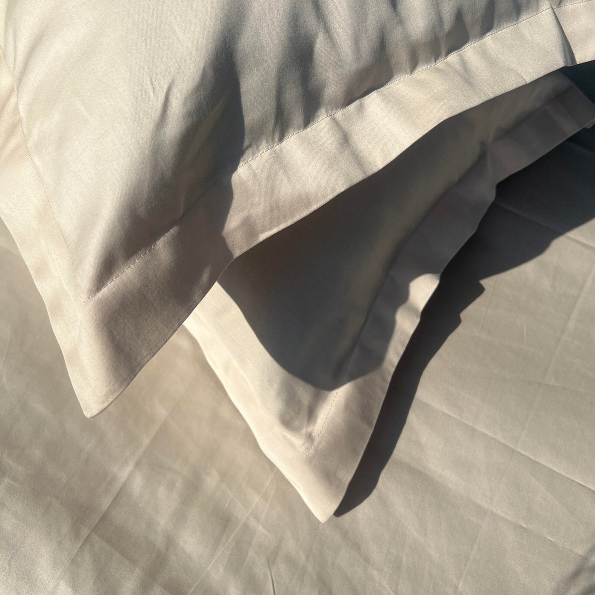 Oats beige pillow covers arranged on bed