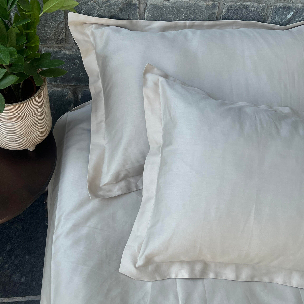 Oats beige bedsheet styled on a made bed