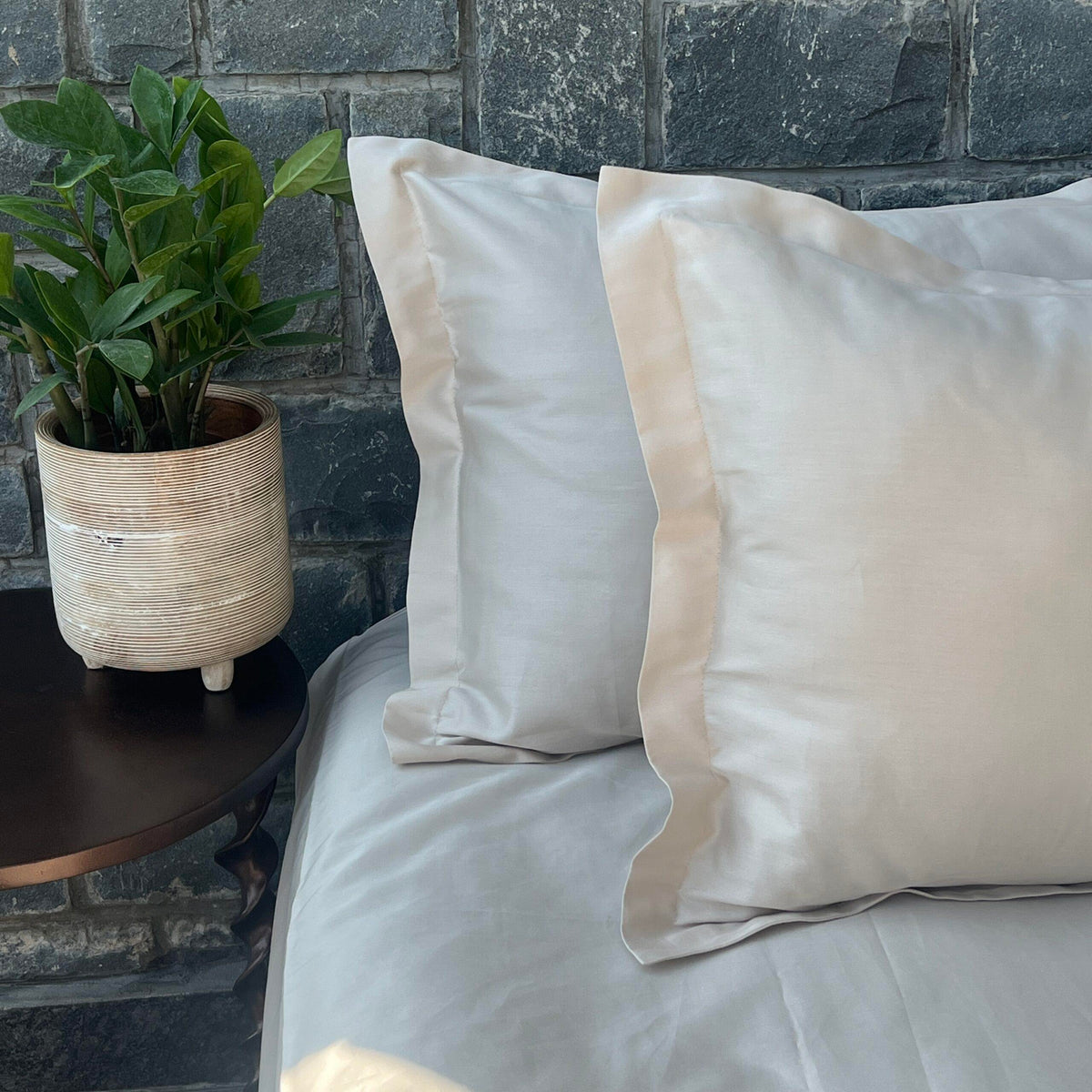 Full bed styled with oats beige Luxe bedsheet