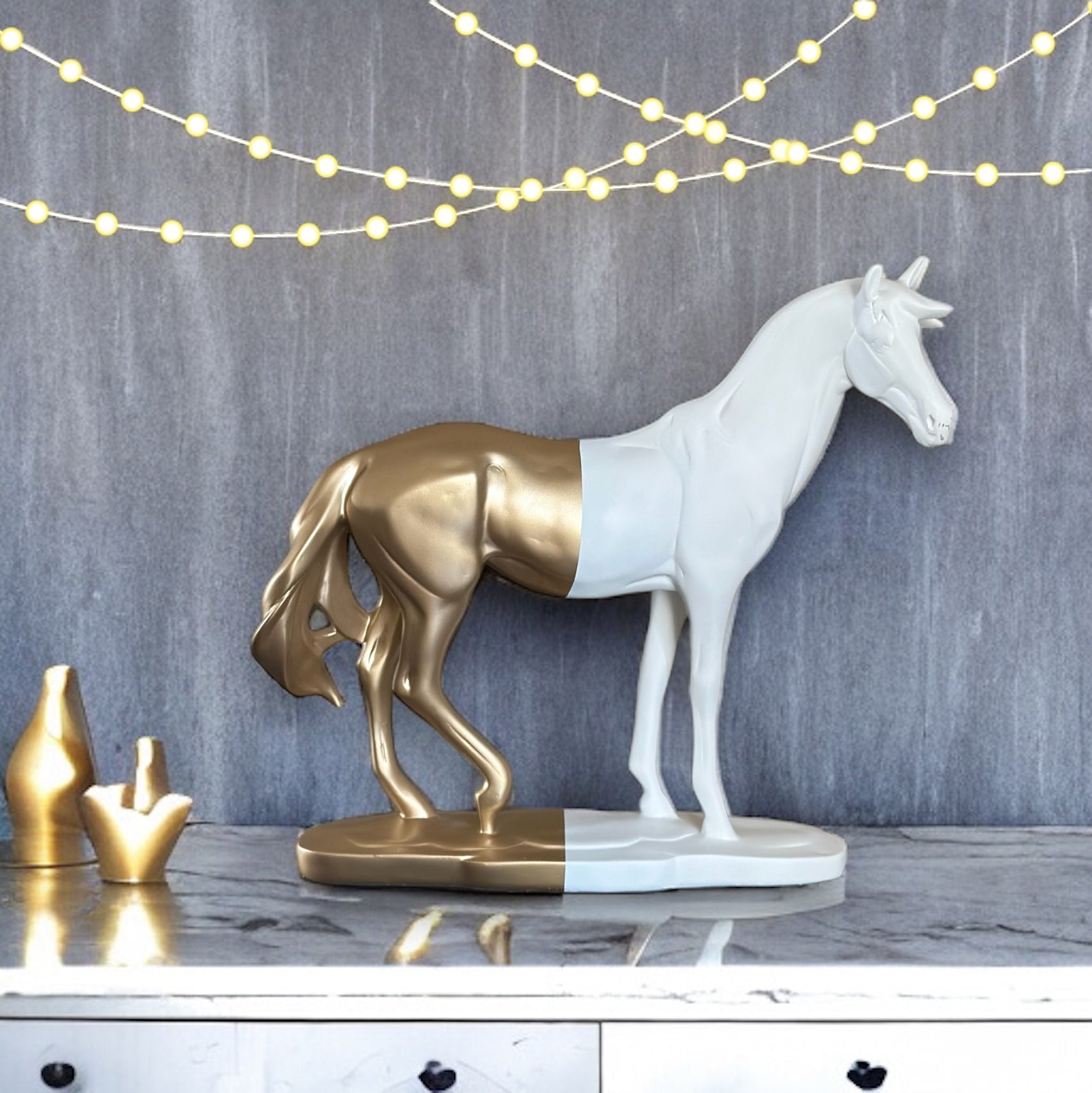 White and gold Roman horse sculpture on display.