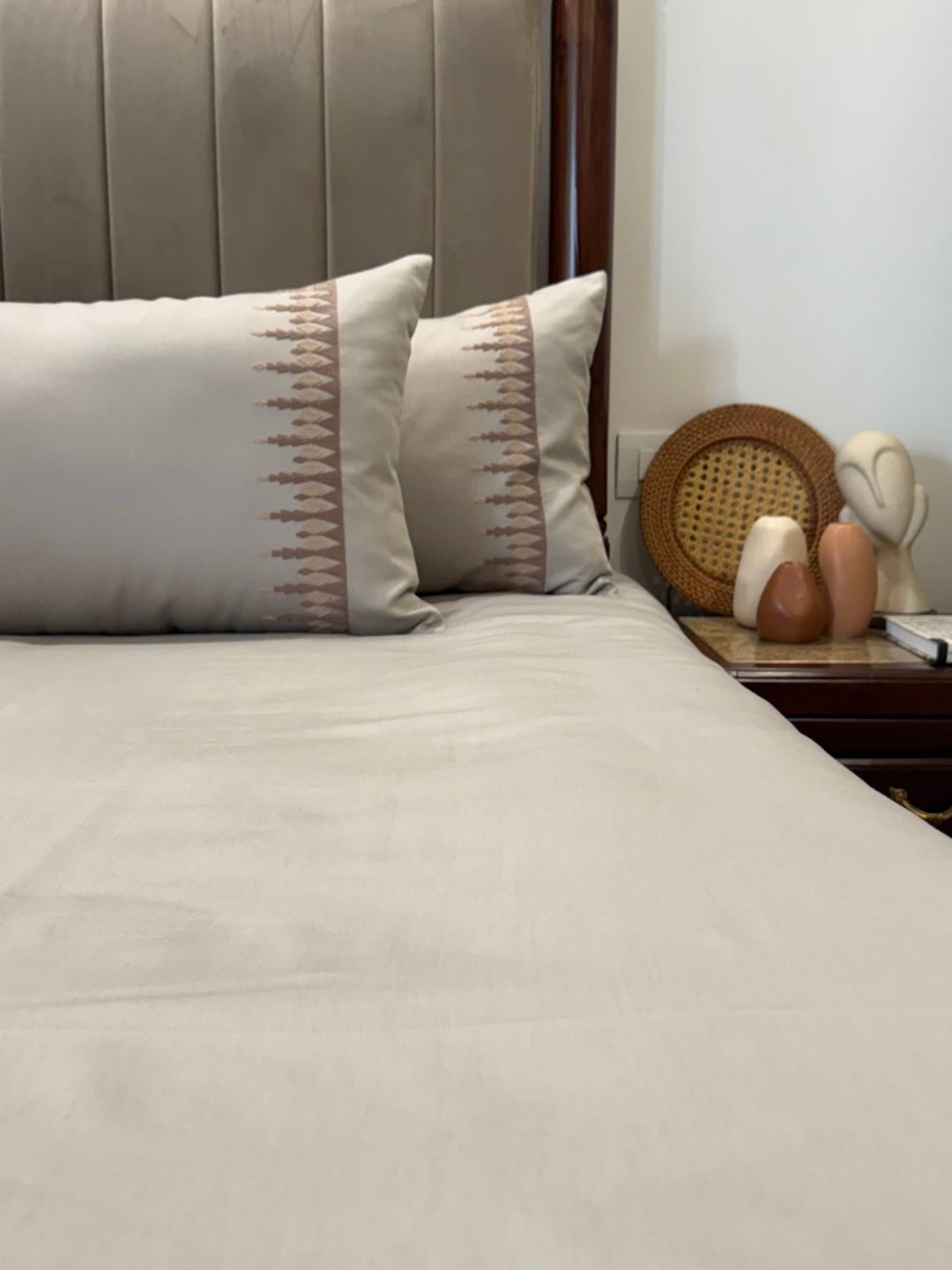 Close-up of beige embroidered pillow cover