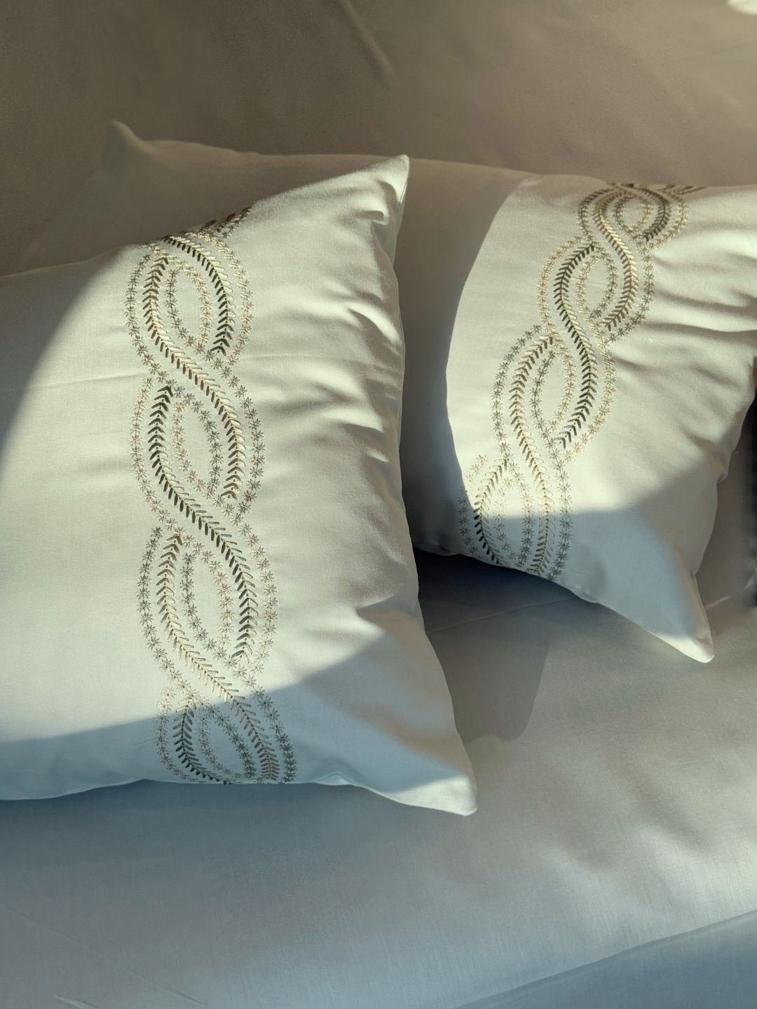Lily sage green bedsheet set styled on bed