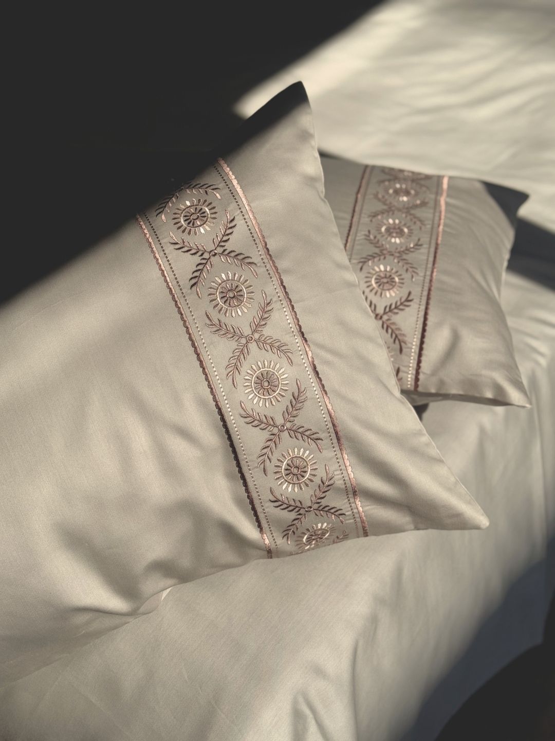 Close-up of beige embroidered pillow cover