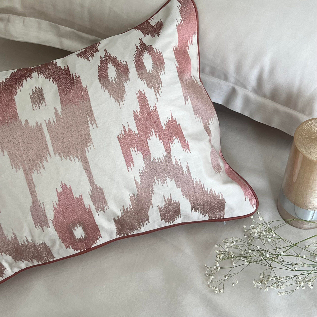 Folded stack of the oats beige bedsheet and pillow covers