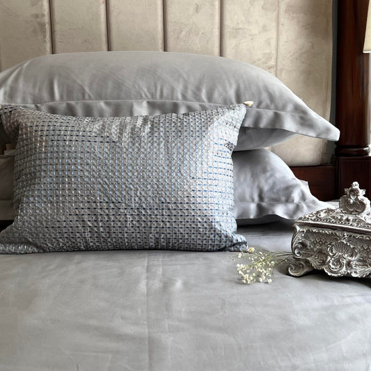 Slate bedsheet set styled on a made bed