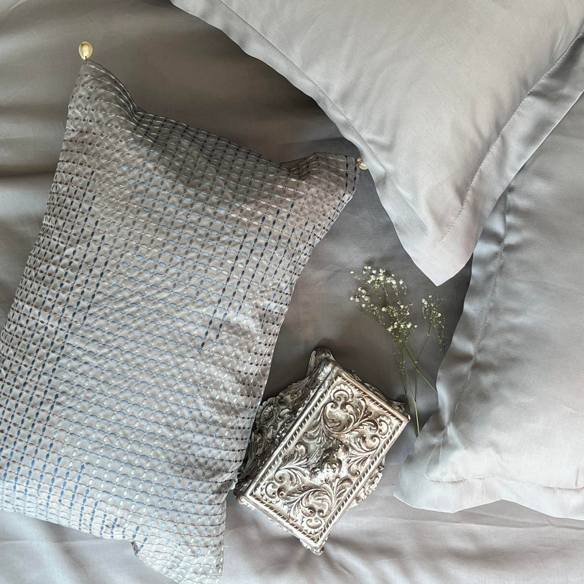 Close-up of the embroidered accent cushion cover