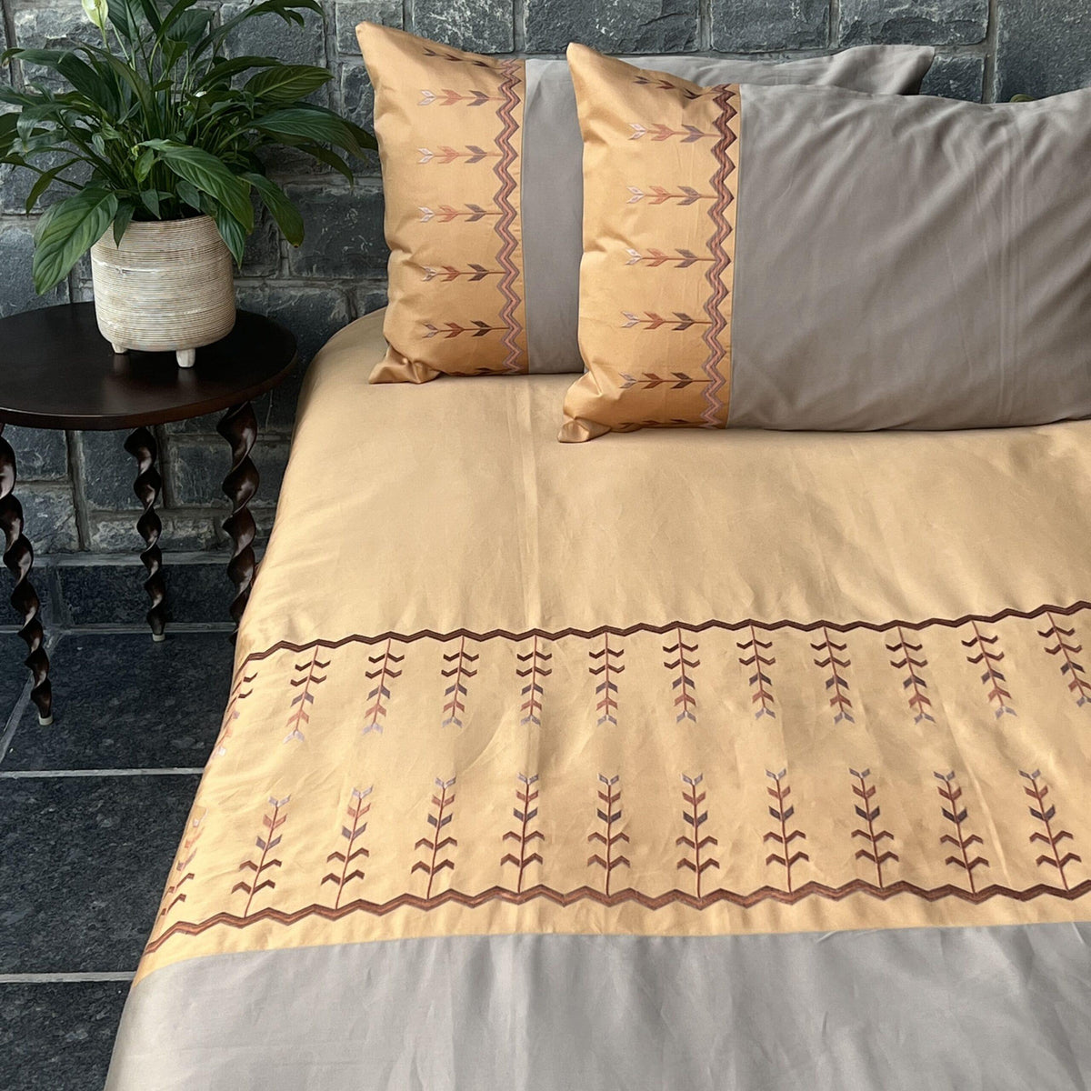 Aero honey mustard and mocha bedsheet set styled on bed