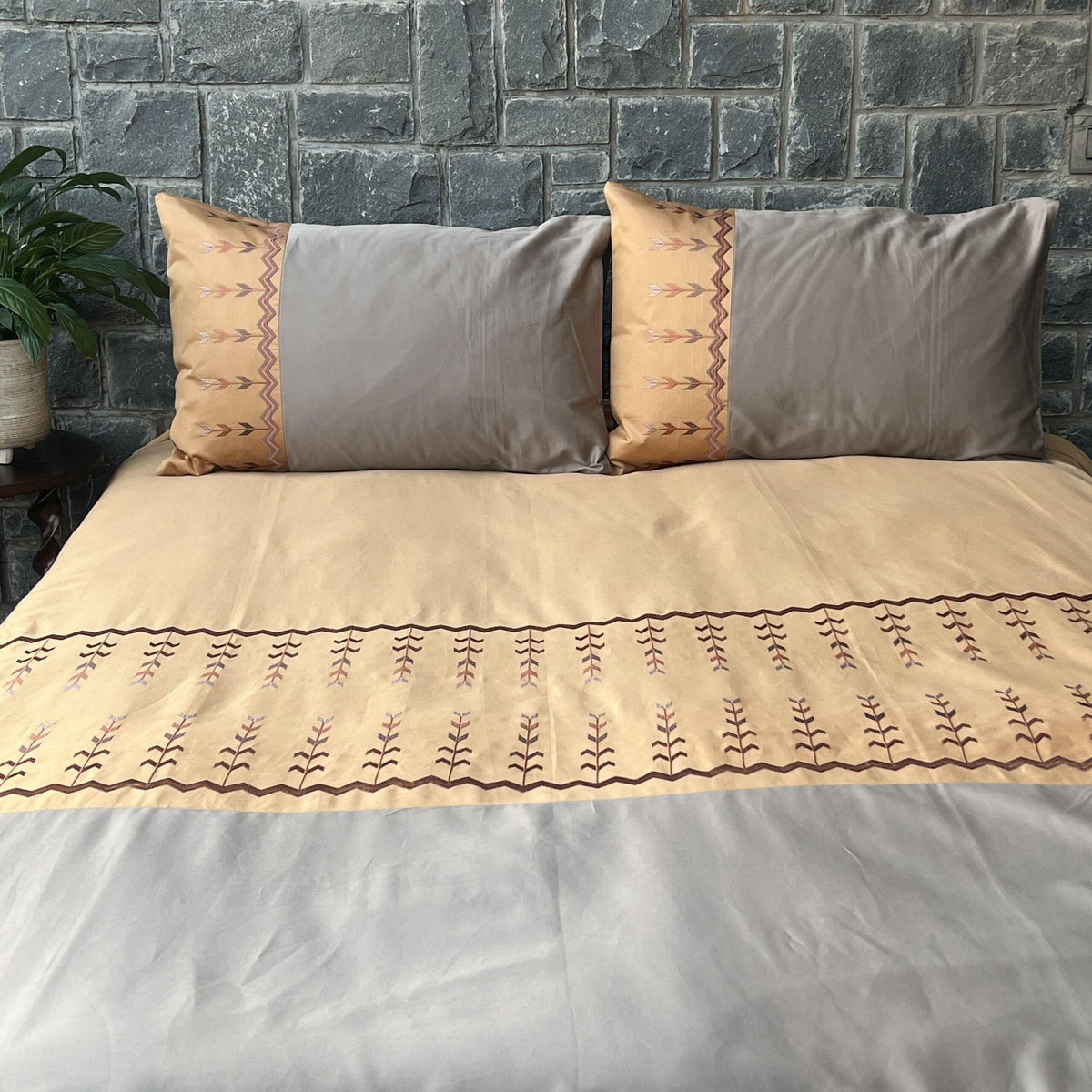 Full bed styled with Aero honey mustard and mocha bedsheet set