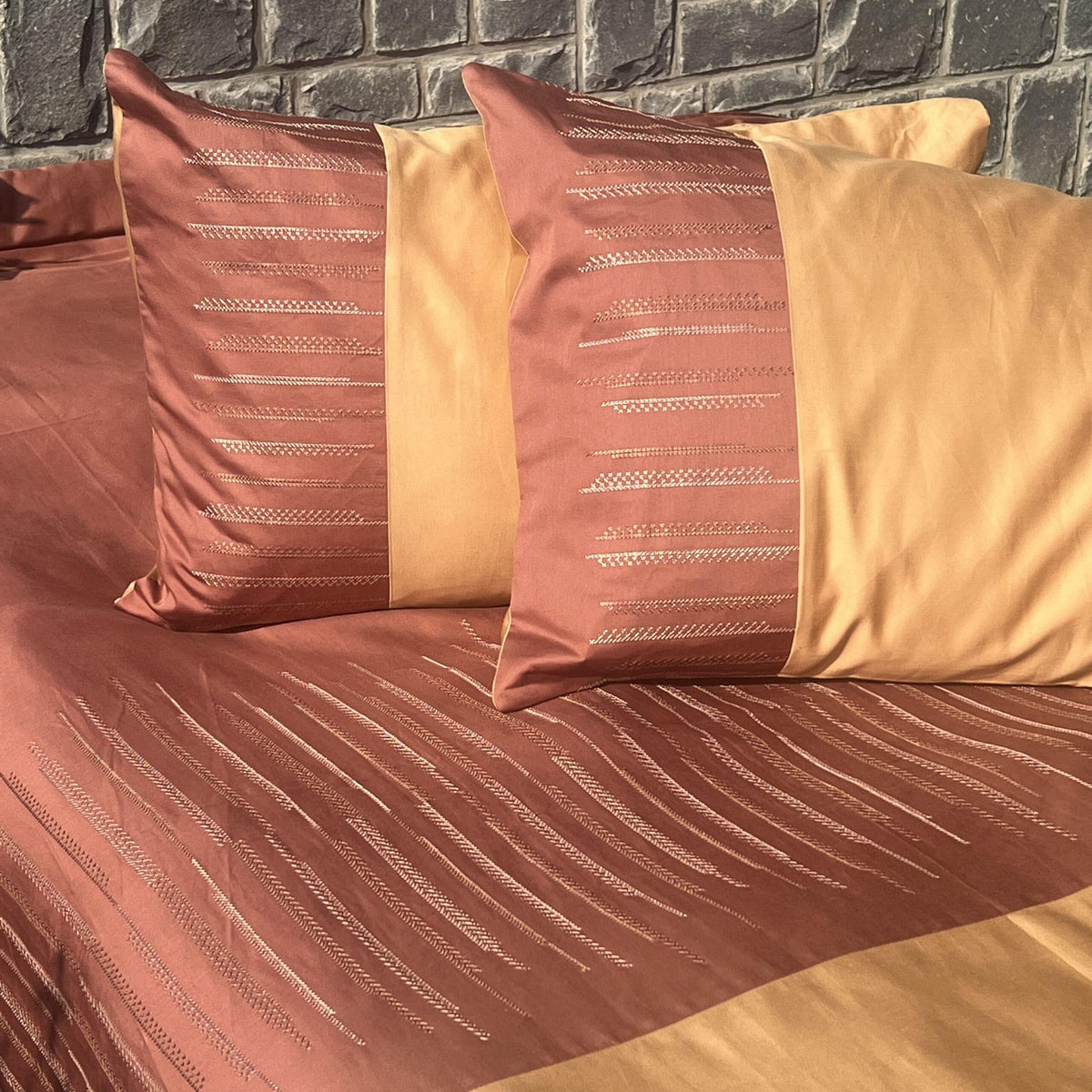 Speckle embroidered bedsheet corner detail