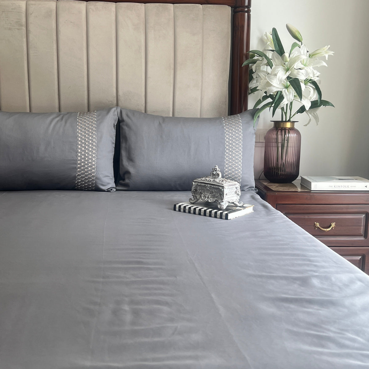 Dark grey Syona bedsheet folded showing fabric texture