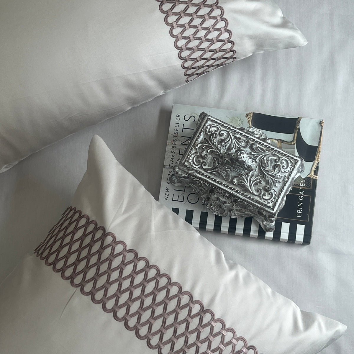 Close-up of ivory embroidered pillow cover detail