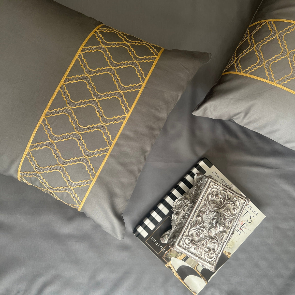 Close-up of dark grey embroidered pillow cover