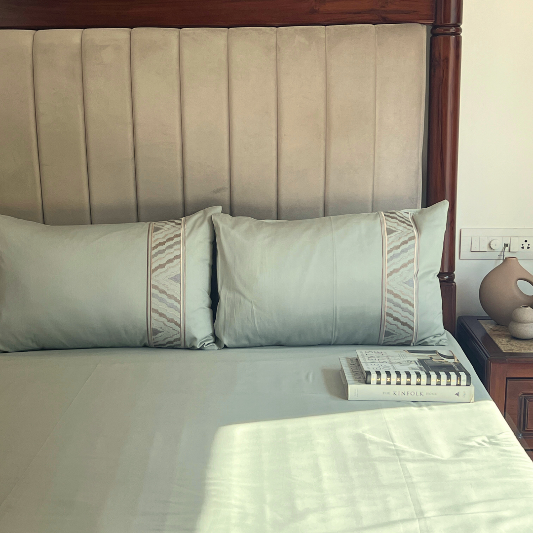 Full bed styled with sage green Dreams bedsheet set