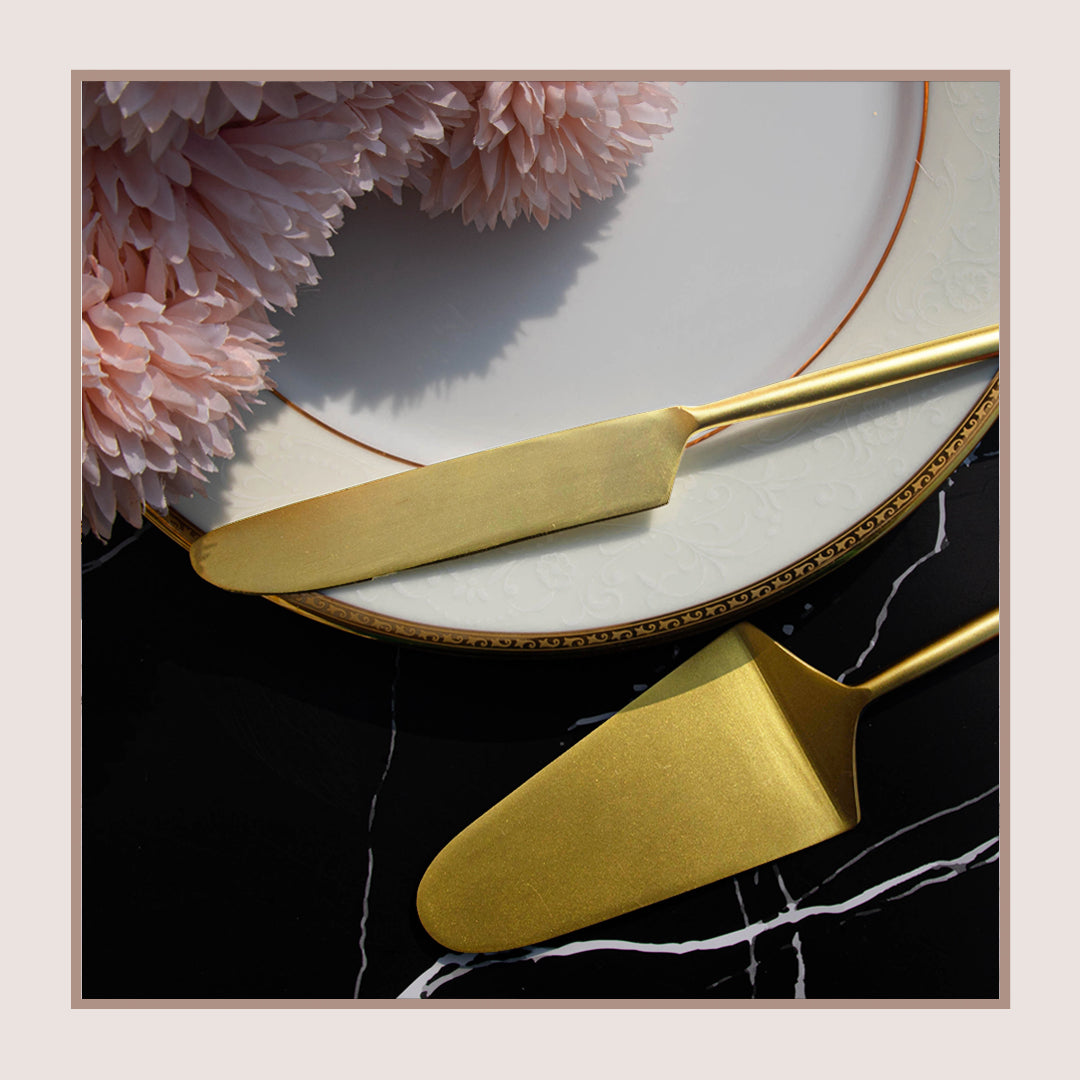 Gold cake knife and server set with brushed metal finish.