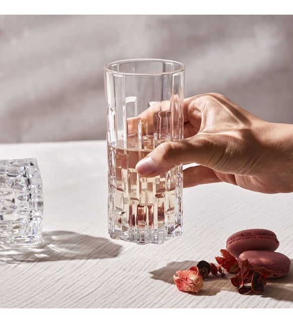 Geometric Etna tumbler glass held in hand.