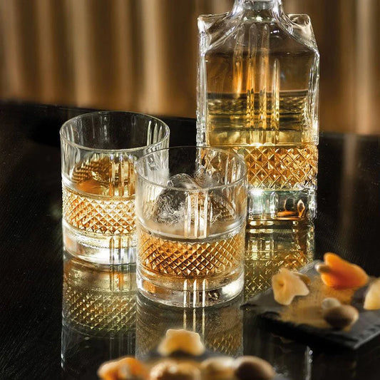 Brillante DOF tumblers set with diamond cut design and whiskey.