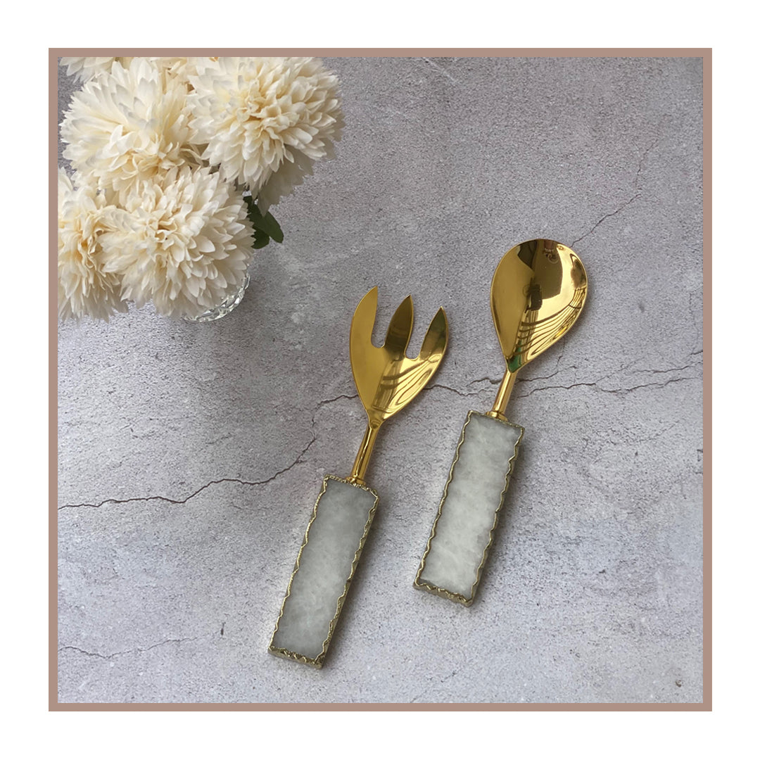Gold salad servers with quartz handles for stylish dining.